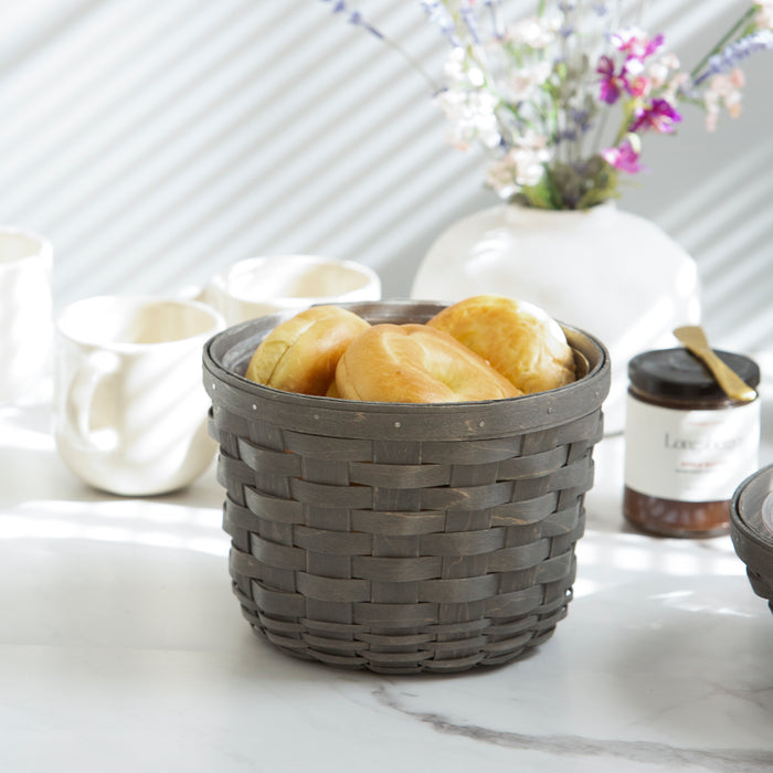 Pewter Medium Round Basket Set with Protector holding baked goods.