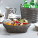 Pewter Short Round Basket Set with Protector holding fruit pieces.