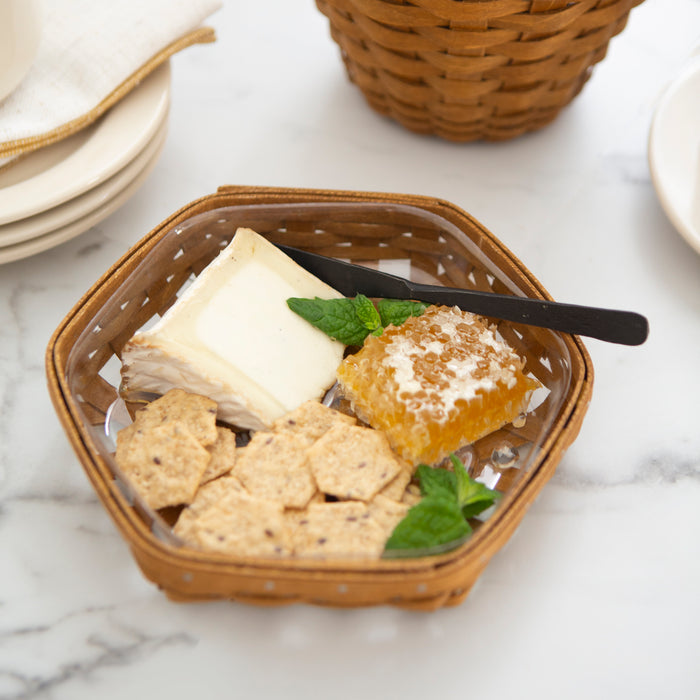 Rusty Spice Honeycomb Basket Set with Protector holding cheese and crackers.