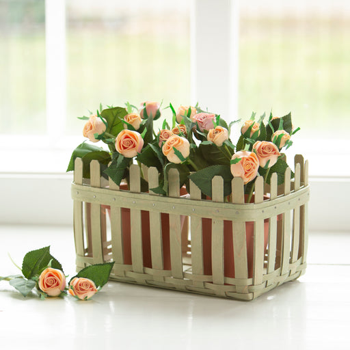 Front of Norman Rockwell Picket Fence Basket - Soft Green, holding roses