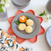 Flower Petal Basket - Coral with Smoke Dessert plate, holding muffins.