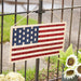 Americana Woven Flag Panel hanging on fence