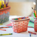 Longaberger x Crayola Small Crayon Basket Set - Scarlet holding crayons