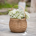 Medium Flower Girl Basket Set with Protector - Light Brown holding flowers.