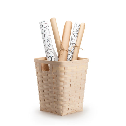 Whitewashed Flare Waste Basket holding wrapping paper rolls.