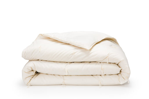 Wool comforter on white background